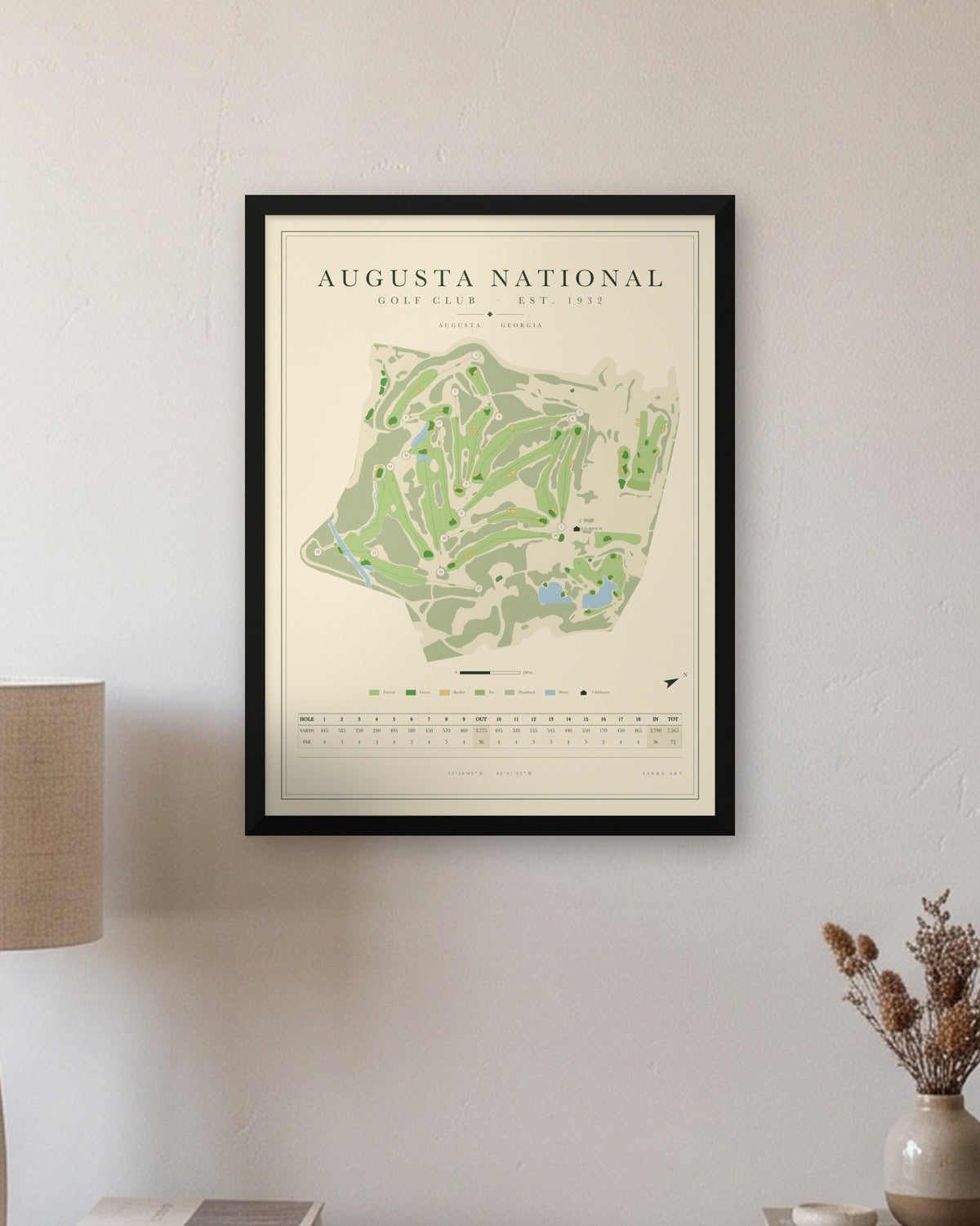 Augusta National golf course map print in a black frame, hung on a wall