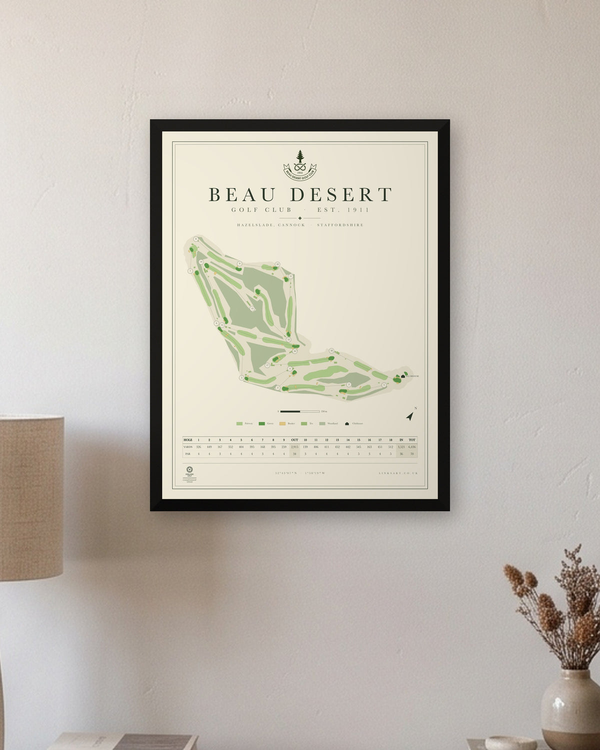 Beau Desert golf course map print in a black frame, hung on a wall