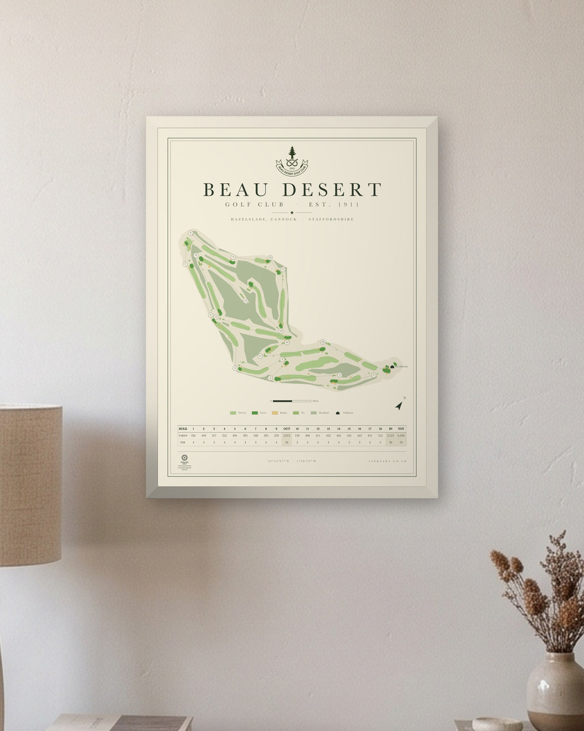 Beau Desert golf course map print in a white frame, hung on a wall