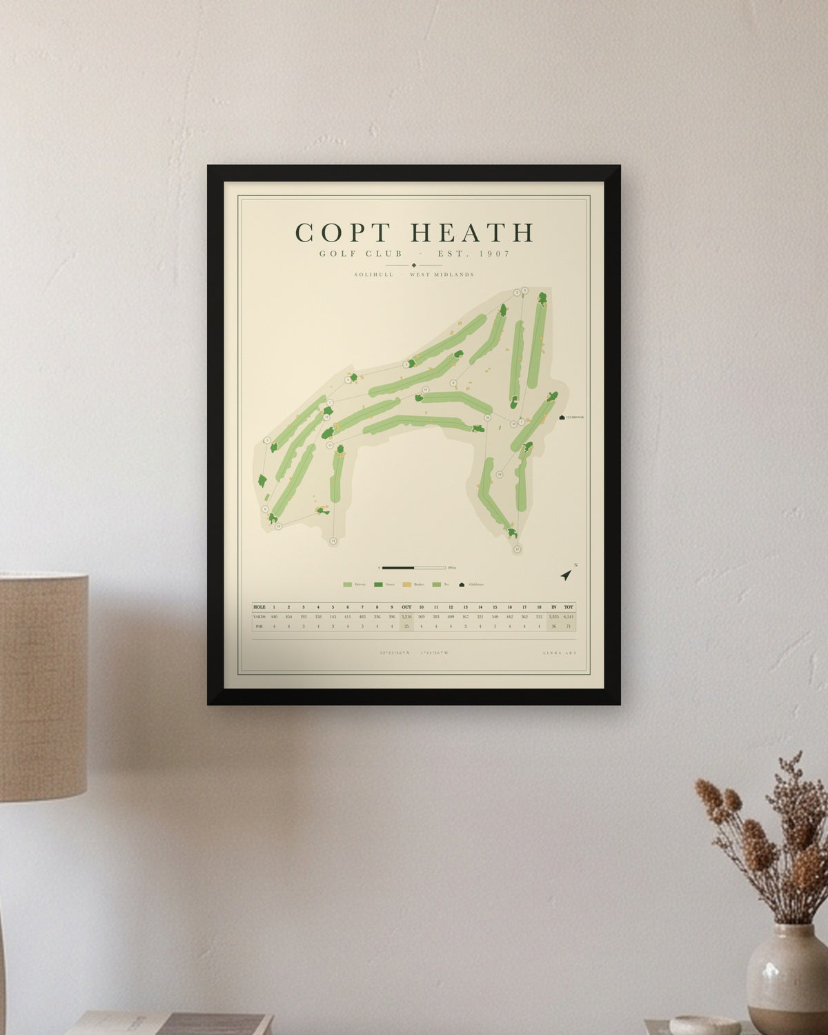 Copt Heath golf course map print in a black frame, hung on a wall