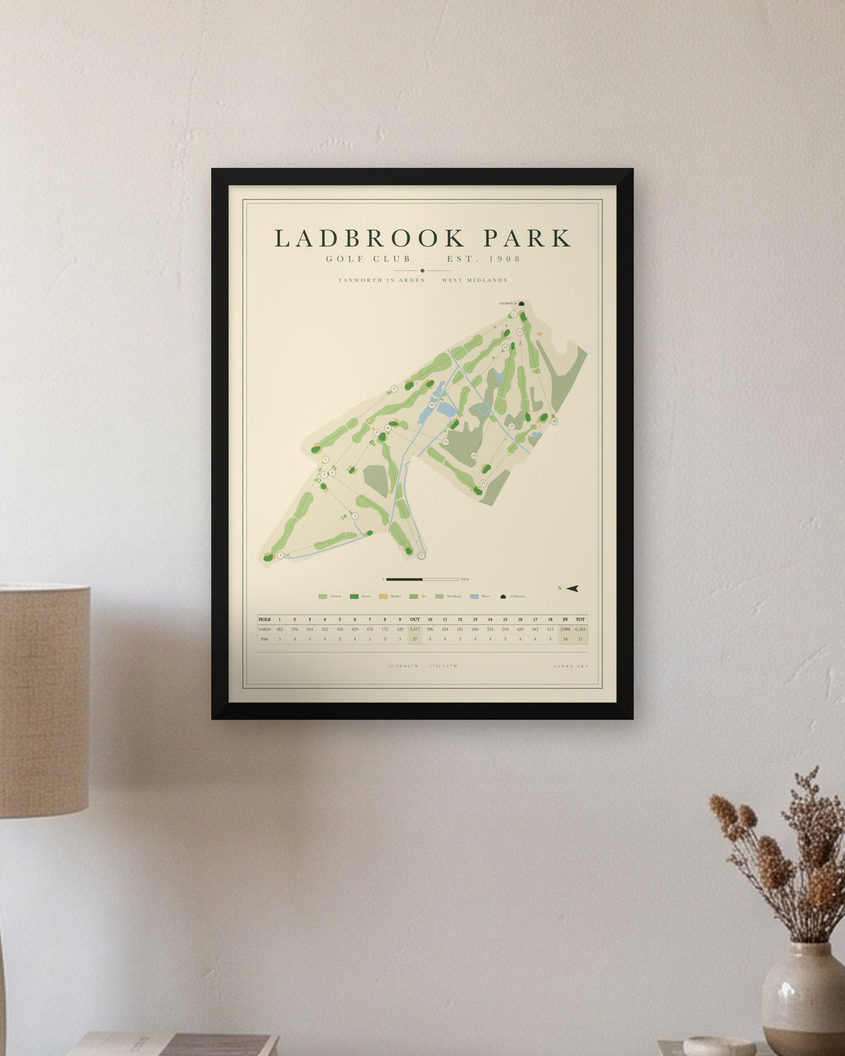 Ladbrook Park golf course map print in a black frame, hung on a wall
